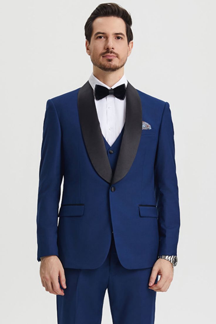 This one button tuxedo by Stacy Adams features a wide black satin shawl lapel, matching pants and vest. This comes in a hybrid fit (Sizes 34-44 = Slim Fit | Sizes 46+ = Modern Fit) Tailored Tuxedo With Lapel Collar For Groom, Blue Tuxedo Blazer For Black-tie Events, Elegant Blue Tuxedo With Lapel Collar, Blue Tuxedo With Lapel Collar, Blue Tuxedo Blazer, Tailored Tuxedo Suits With Shawl Collar, Black Tuxedo With Shawl Collar, Fitted Tuxedo With Lapel Collar For Groom, Tailored Satin Suit With Suit Collar