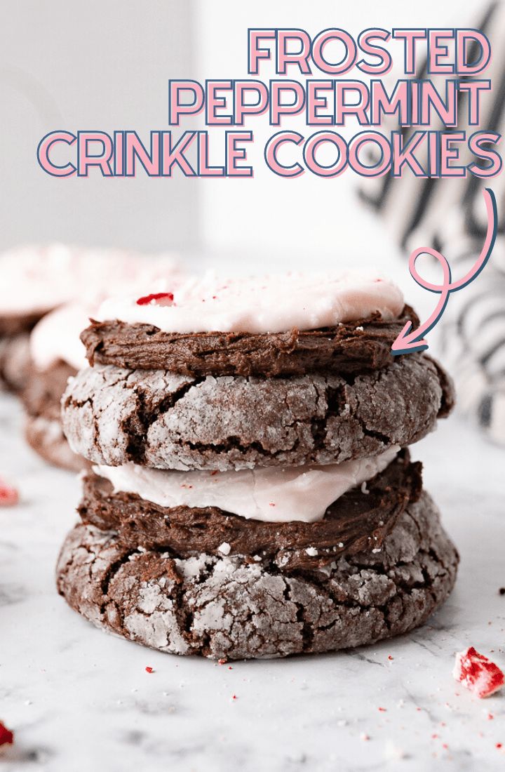 frosted peppermint crinkle cookies stacked on top of each other