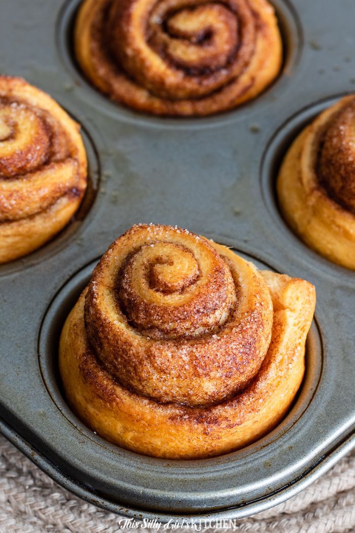 cinnamon rolls in a muffin tin ready to be baked