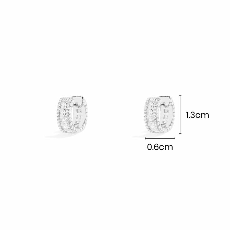 These earrings are handcrafted from sterling silver and paved with white cubic zirconia.2-year worldwide warranty Material: Sterling silver, white cubic zirconia All our products are handcrafted and microset by hand in our ateliers Color: Silver Size: Small (Length: 1.3 cm ; Width : 0.6 cm) Apm Monaco, Diamond Gift, Metal Shop, Monaco, Ring Earrings, Jewelry Shop, Cubic Zirconia, Hoop Earrings, White Gold