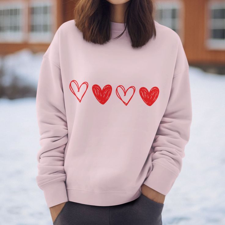 "Introducing our valentines sweatshirt - A Must-Have Addition to Your Wardrobe! Experience the ultimate in cozy comfort with our specially crafted sweatshirt. Designed with your utmost comfort in mind, this sweatshirt is perfect for those who appreciate quality, style, and functionality. 🌟 Key Features 🌟 🔹 Seamless Perfection: Say goodbye to irritating side seams, ensuring a smooth and comfortable fit all day long. 🔹 Ribbed Knit Collar: The ribbed knit collar not only adds a touch of sophistication but also provides extra durability. It's the perfect blend of style and substance. 🔹 Premium Materials: Made from a blend of 50% cotton and 50% polyester, our sweatshirt offers the ideal combination of softness and durability. 🌬️ Easy Care Instructions 🌬️ ✅ Machine Wash: Cold water is all Relaxed Fit Long Sleeve Hoodie As Gift, Long Sleeve Relaxed Fit Hoodie As Gift, Trendy Heart Graphic Sweatshirt For Winter, Trendy Winter Sweatshirt With Heart Graphic, Pink Crew Neck Sweater With Heart Graphic, Pink Casual Sweatshirt With Heart Graphic, Casual Pink Sweatshirt With Heart Graphic, Pink Heart Print Sweater For Valentine's Day, Valentine's Day Cotton Sweatshirt Gift