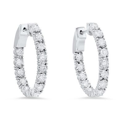 This elegant pair of oval-shaped inside out hoop earrings showcases 1.51 carats of round brilliant cut diamonds, detailed by an intricate illusion setting. They measure approximately 0.75 inches. Luxury Diamond Jewelry With Lever Back Ear Wires, Luxury Oval Diamond White Hoop Earrings, Oval Hoop Earrings In Diamond White With Brilliant Cut, Diamond White Oval Hoop Earrings With Prong Setting, Oval Diamond White Hoop Earrings Fine Jewelry, Diamond White Oval Hoop Earrings For Formal Occasions, Oval Diamond Hoop Earrings With Diamond Accents, Oval Diamond Hoop Earrings With Accents, Oval Brilliant Cut Hoop Earrings For Formal Events