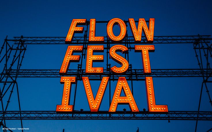 a neon sign that reads flow fest festival