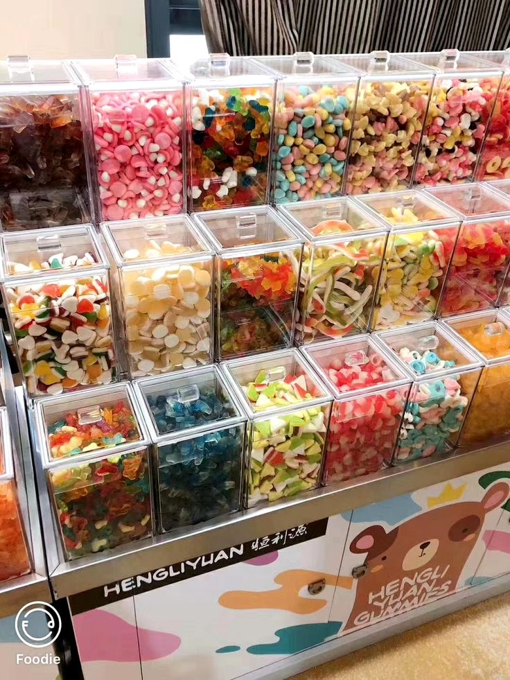 a display case filled with lots of different colored candies