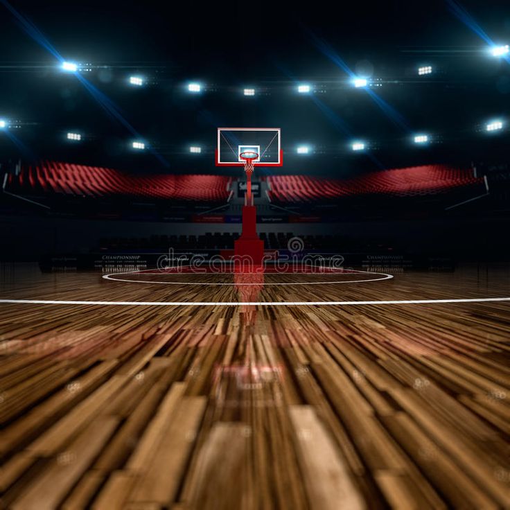 an empty basketball court with bright lights in the background and wood flooring on one side