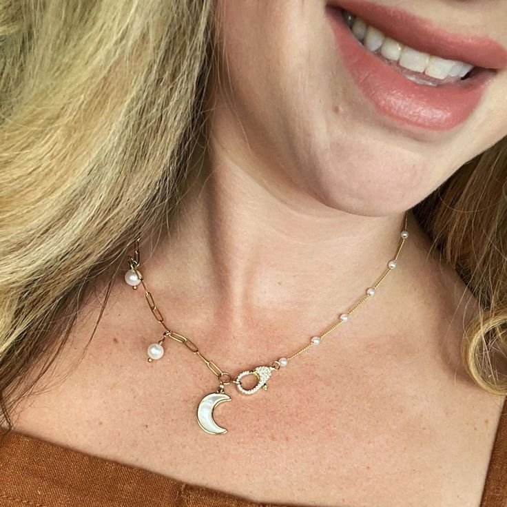 Step into the glow of elegance with the Moonshine Necklace from Lackore Couture—a symbol of femininity, strength, and mystery. This handcrafted beauty is designed for the woman who embraces both her bold and gentle sides. Crafted with exquisite attention to detail, it features a delicate, crescent moon pendant that adds a touch of celestial magic to any outfit. Whether you’re dressing up for a night out or adding subtle charm to your everyday look, this necklace is the perfect accessory. Dipped Celestial Magic, Crescent Moon Pendant, The Glow, Moon Pendant, Moon Necklace, Pearl Drop, Crescent Moon, Everyday Look, Crescent