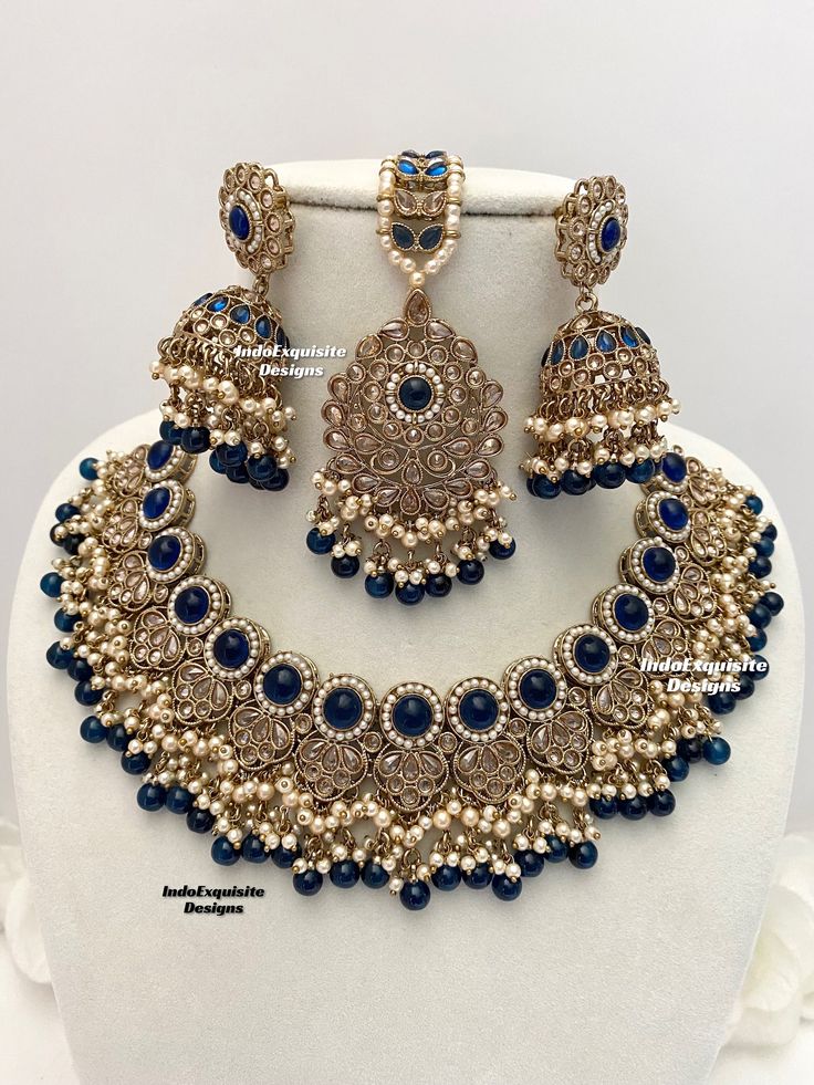 Antique Gold Polki Necklace Set comes with Jhumki earrings and tikka / Indian Jewelry/ High Quality Kundan and Polki Jewelry/ Bollywood Jewelry/Wedding/Navy blue  All items are shipped from Brampton, Ontario, Canada. If you need your item by a certain day, please reach out to us for express delivery option before placing the order so that we can update the shipping for you. Standard shipping/delivery timeline Below are the delivery timeline estimates once the order ia shipped ---> USA delivery t Bollywood Blue Bridal Necklace Hand Set, Blue Hand Set Necklace For Diwali, Blue Kundan Chandbalis For Celebration, Blue Temple Jewelry Jhumkas For Celebration, Temple Style Blue Jhumkas For Celebration, Blue Hand-set Kundan Necklace For Weddings, Blue Bollywood Jewelry With Stone Work, Blue Kundan Bridal Necklace Hand Set, Blue Kundan Necklace Bollywood Style For Festivals