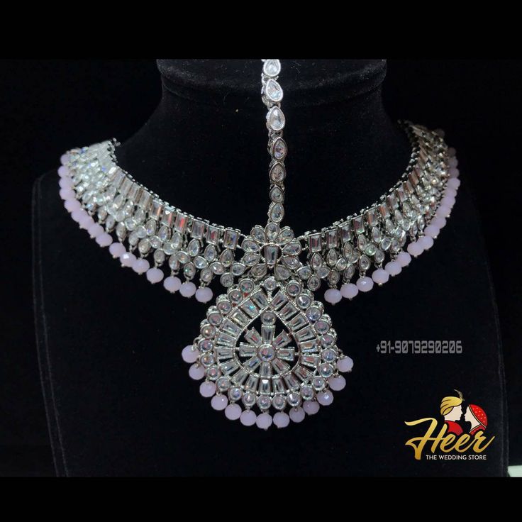 This bridal set is made up with rodium silver polish and gives up an excellent royal look. It comes with Choker, necklace, long haar, earrings, mathapati, Hath Panja, passa. For more designs or any query. Contact us : +91-9079290206 Silver Tilla Bollywood Bridal Earrings, Silver Kundan Sets For Festive Occasions, Silver Kundan Sets For Festive Season, Silver Sets With Stone Work For Wedding, Bollywood Style Silver Bridal Earrings With Tilla, Festive Silver Kundan Set, Heavy Silver Bridal Earrings For Wedding, Silver Wedding Sets With Stone Work, Festive Kundan Silver Sets