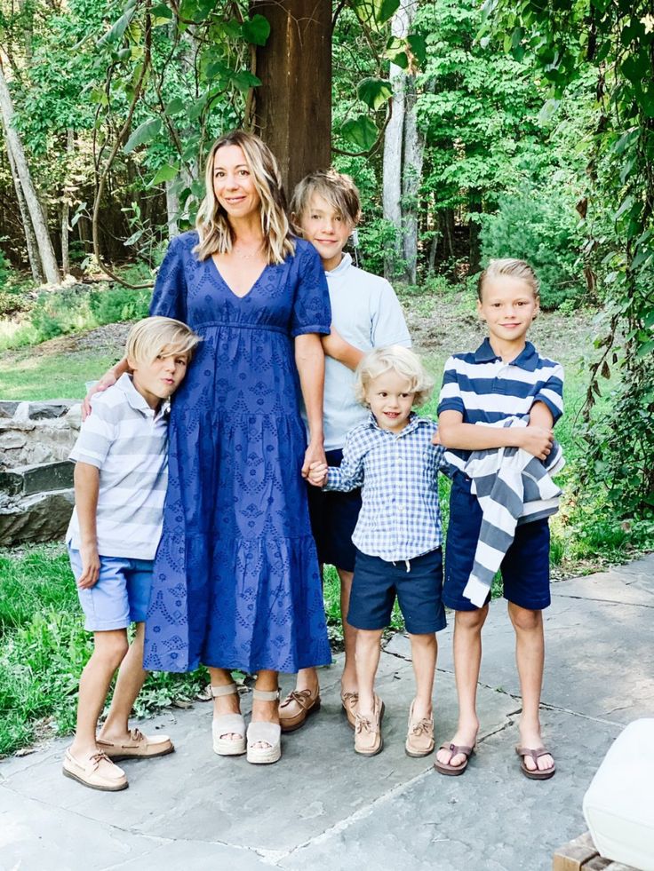 a woman and four children posing for a photo