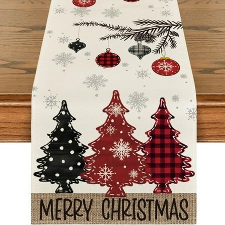 a christmas table runner with ornaments on it