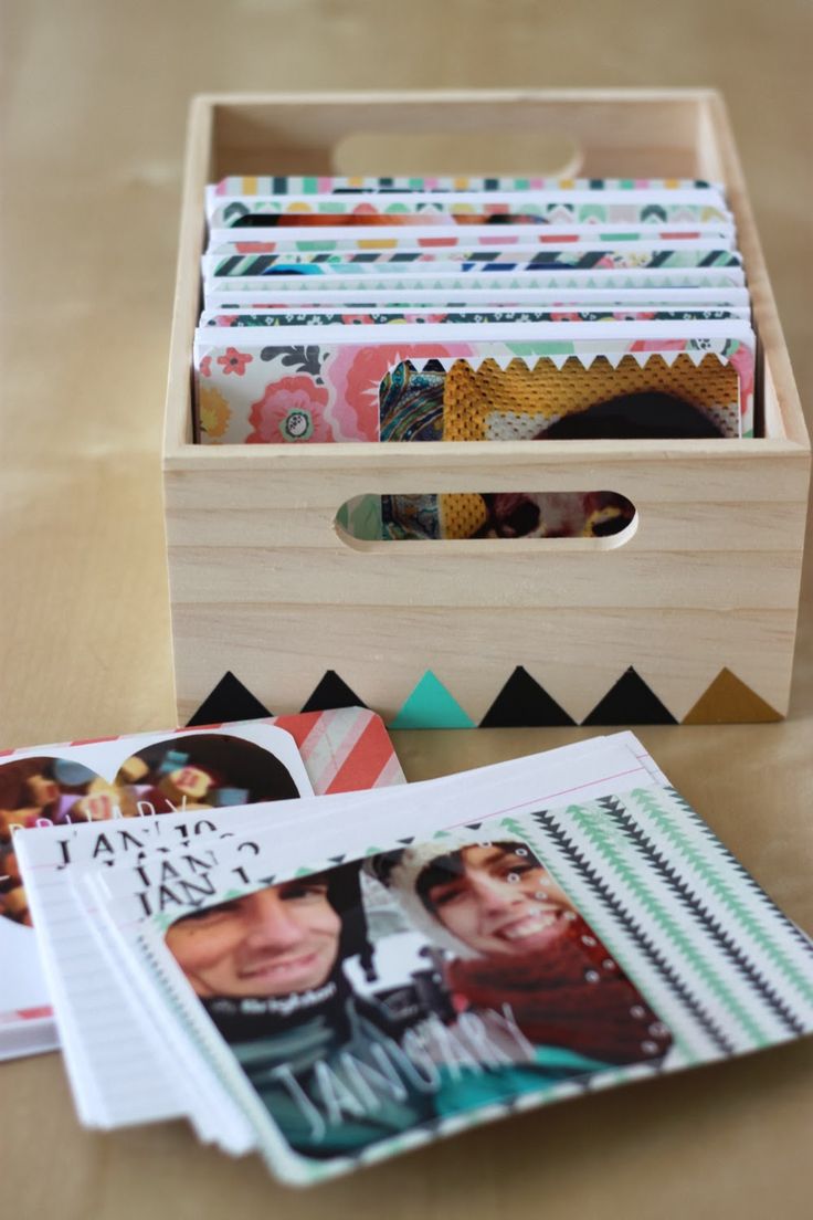 a wooden box filled with lots of cards