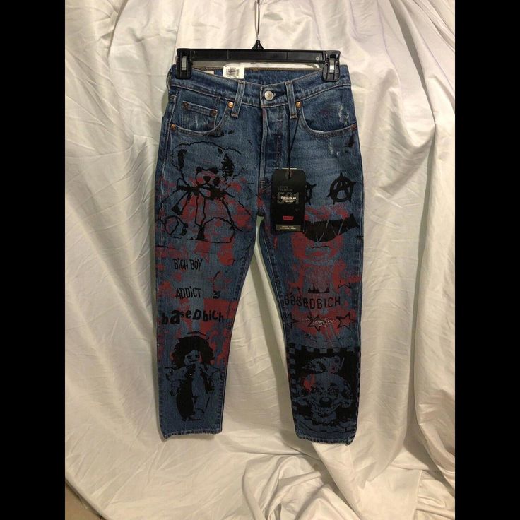 Upgrade Your Denim Collection With These Levi's 501 Original Cropped Hi Rise Jeans. The Unique Painted Art Detailing, Logo Accent, And Zipper Make These Super Rare Jeans A Must-See Addition To Your Wardrobe. With A Flattering High Rise And Regular Fit, They Are Perfect For Any Season And Occasion. The 5-Pocket Design And Button Closure Add A Classic Touch To The Denim Fabric, While The 100% Cotton Material Ensures Comfort And Durability. Machine Washable And Medium Fabric Wash Make It Easy To Ma Levi's Jeans For Summer Streetwear, Levi's Summer Streetwear Jeans, Levi's Streetwear Bottoms With Five Pockets, Levi's Medium Wash Bottoms For Streetwear, Medium Wash Straight Leg Bottoms With Graphic Print, Medium Wash Straight Leg Jeans With Graphic Print, Denim Blue Graphic Bottoms For Streetwear, Levi's Blue Bottoms For Streetwear, Denim Blue Straight Leg Jeans With Graphic Print