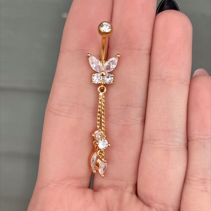 - 316L Surgical Steel - Silver, Gold, or Rose Gold - Cubic Zirconia Gems - 10mm bar, 14G - Externally Threaded #bellyring #bellyrings #bellybuttonring #bellybuttonrings #bellybuttonpiercing #bellypiercing #navelring #navelpiercing #bellybuttonjewelry #naveljewelry #bellybuttonpiercings #cutebellyrings #etsysellersofpinterest #etsy #etsyseller #etsyshop #etsyjewelry #etsyfinds #etsystore #etsylove #etsysellers Rose Gold Adjustable Jewelry With Butterfly Charm, Adjustable Rose Gold Jewelry With Butterfly Charm, Elegant Gold Belly Rings Gift, Elegant Metal Dangle Belly Rings, Elegant Hypoallergenic Belly Rings, Gold Hypoallergenic Belly Rings, Elegant Internally Threaded Belly Rings As Gift, Elegant Nickel-free Belly Rings, Elegant Metal Belly Rings As Gift