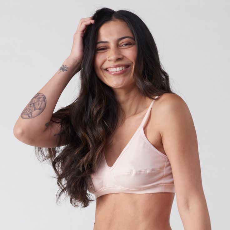 A more supportive style for larger cup sizes. Horizontal seams across the cups, fabric front straps and other thoughtful details shape and support—without sacrificing style or comfort. Designed with measurements from real women, not mannequins. Supports A-D cups. Slip-on style, no back closure. Adjustable straps with rose gold hardware. Double-layered, organic cotton with a covered elastic band. 94% organic cotton, 6% spandex. Cut and sewn in the U.S. Machine wash and dry. Size Guide Supportive Nursing Bra For Everyday Use, Everyday Fitted Bra With Medium Bust Support, Everyday Nursing Bra With Removable Pads, Stretch Nursing Bra For Everyday, Everyday Bra With Padded Cups, Stretch Bra With Removable Cups, Supportive Solid Nursing Bra, Fitted Bra With Removable Pads For Everyday, Fitted Nursing Bra With Padded Cups For Everyday