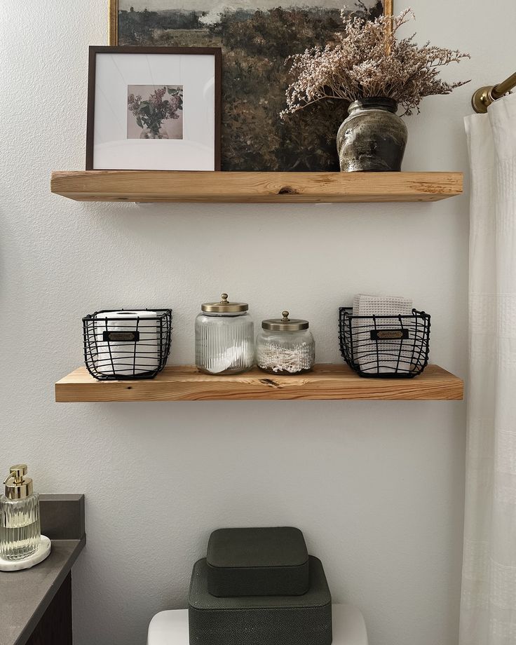 two wooden shelves above a toilet in a bathroom