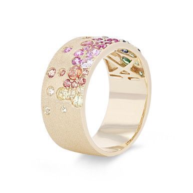 Crafted in a cigar style, this band features a stunning display of scattered rainbow colored sapphires totaling 1.36 carats. It measures 8.7 millimeters wide. Colored Sapphires, Diamonds Direct, Rainbow Sapphires, Future Engagement Rings, Jewelry Inspo, Fashion Jewellery, Girls Fashion, Cute Jewelry, Luxury Jewelry