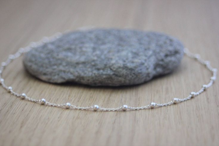 "Minimalist choker necklace in sterling silver chain with beads - silver necklace - silver choker - fine choker -  pearl chain necklace Sterling silver choker necklace in minimalist style. Sterling silver chain 925/1000 with 4 cm extension chain. Sterling silver beaded chain with 2.5mm beads. Available in several lenghts. Do not hesitate to contact me if you want another length. ♦ All my jewelry is made to order according to the dimensions you have chosen. Please check your measurements carefully. ♦ My jewelry is also delivered \"ready to offer\" and packaged in a pretty gift bag. Sending neat. For further information, please feel free to contact me via the tab \"contact the creator\" (answer within 24 hours). Create EmmaFashionStyle Siret: 792 006 454 00013 reproduction prohibited Minimal Sterling Silver Choker Necklace, Sterling Silver Choker, Pearl Chain Necklace, Silver Choker Necklace, Silver Choker, Square Bead, Geometric Necklace, Cool Necklaces, Pretty Gift