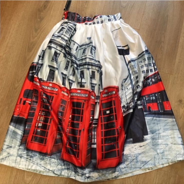 Nwt London Red Bus Red Phone Booth Skirt By Yangelo. Beautiful, Sunny, Airy, Feels Like Silk, Unlined. Vibrant Colors With London Cityscape And Their Famous Bus & Phone Booths Design. Slightly Pleated, Mid-Length, Elastic Waist And Side Zip Closure. Size M. Measurements: Waist 11.5" (Unstretched, Has Elasticwaist Band), Length 29" (Waist To Bottom Hem). @Skirts Bin #1 White Winter Skirt For Day Out, Red Full Skirt For Summer, White Midi Skirt For Winter, White Flowy Skirt For Winter, Red Flared Skirt For Day Out, Red Midi Skirt For Day Out, Red Pleated Skirt For Day Out, Red Long Skirt For Day Out, Booths Design