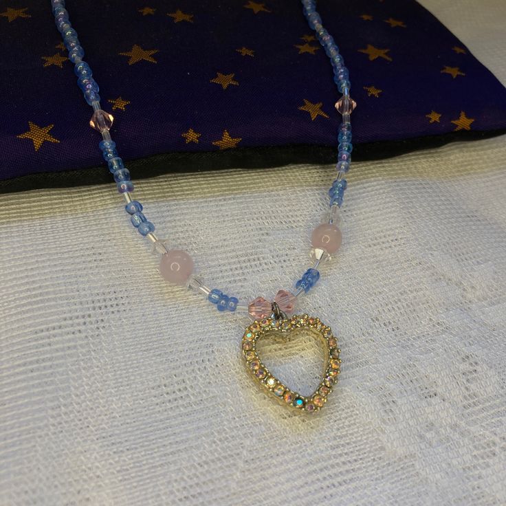 This necklace says Trans Rights ! The light pink of the rose quartz, the translucent blue beads, and white spacers all come together to make a very subtle trans pride necklace. Rose Quartz is said to promote self love. The heart shaped pendant has a crystal side and a pearl side, so there's two looks in one. The cute pastel colors will make this piece stand out on any occasion ! Cute Pastel Colors, Pride Necklace, Trans Rights, Cute Rose, Trans Pride, Rose Quartz Necklace, Necklace Rose, Heart Shape Pendant, Quartz Rose