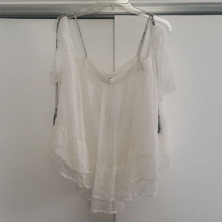 This Is A Very Lightweight, Chiffon, Off The Shoulders Blouse. Extra Flattering For A Few Different Sizes, Ots An Off White Color With Delicate Lace Along The Top, The Strings That Tie The Sleeves Are Woven Black, & White, & The Blouse Has A Slightly Ruffled Flounce At The Bottom, Fully Lined, As The Chiffon Is Transparent. Sheer V-neck Top For Vacation, Summer Lace Blouse, Lace Trim Blouse For Beach, Bohemian Sheer Beach Tops, Summer Lace Blouse For Beach, Lace V-neck Summer Blouse, Lace V-neck Blouse For Summer, Summer Lace V-neck Blouse, Flowy Lace Tops For Vacation