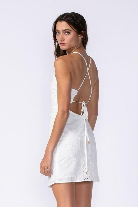 Final Sale - Get it before it's gone! Things are heating up in the Gia White Eyelet Halter Mini Dress! Embroidered eyelet a plunge neckline (that you can criss-cross to create a keyhole neckline) and dual straps that criss cross and tie in the back. A low back connects to a figure-hugging bodycon mini skirt. Lined. DETAILS & CARE Cotton/Polyester. Dry Clean. Imported. Spring V-neck Cross-tied Dresses, White Cross Back Dresses With Crisscross Straps, White Dresses With Crisscross Straps And Cross Back, White Strappy Back Dress With Crisscross Straps, White Dress With Crisscross Straps And Strappy Back, White Dresses With Crisscross Straps And Strappy Back, Fitted Mini Dress With Cross Back For Brunch, Elegant Cross Back Mini Dress For Spring, Elegant Spring Cross Back Mini Dress