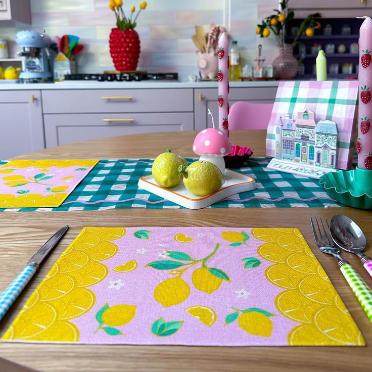 the table is set with placemats, napkins, and utensils