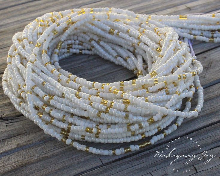 【 𝐓𝐇𝐈𝐒 𝐋𝐈𝐒𝐓𝐈𝐍𝐆 𝐈𝐒 𝐅𝐎𝐑 】 1 set of White & Gold Waist Beads 【 𝐘𝐎𝐔𝐑 𝐎𝐑𝐃𝐄𝐑 】 - Beads are handmade using glass seed beads. - Bonded nylon cord for both tie-on and screw clasps options. - Cord is extremely durable and not elastic. - Tie-on option come with a sample size of super glue to secure your knots. All of our styles are available in 17 to 60 inches. *If you can't find your size (smaller or bigger) listed in the drop-down menu, please contact us so we can help.  【 𝐁𝐄𝐍𝐄𝐅𝐈𝐓𝐒 & 𝐔𝐒𝐄𝐒 𝐎𝐅 𝐖𝐀𝐈𝐒𝐓 𝐁𝐄𝐀𝐃𝐒 】 * Body Adornment * Weight Loss & Weight Management  * Mommy & Me Beads * Period Tracker * Confidence Booster * Boosts Intimacy * Pregnancy Beads * First Period Gift * Gift for Special Occasions Gold Waist Beads, Waist Beads African, Belly Beads, Beads Waist, Beading Cord, Tools For Women, Positive Gift, Belly Jewelry, Waist Beads