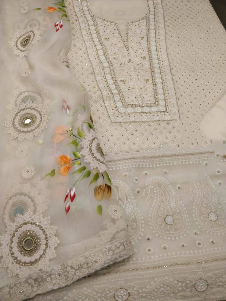 Item Overview ATHARVA Embroidery/Indian Salwar Kameez/Chikan Embroidery Georgete Shirt/ Dupatta/Hand Paint/Cream Off White/Tassels/Plazzos/Pants/GE9100 Dno. GE9001 Fabric:  * Shirt: Georgette/2.5 Mts/Chikan Embroidery  * Dupatta: Georgette Dupatta/Mirror Work/Hand Paint * Bottom Santoon Silk ( Taffeta)2.5 Mts. Excusive Hand Embroidered Party Wear Punjabi Suit. 🌷CUSTOMIZATION (No Extra Charges) * Fabrics Customization: Designs Can be made in different Fabrics. *Color Customization: Designs Can b Cream Sets With Floral Embroidery For Transitional Season, Transitional Floral Embroidered Cream Sets, Transitional Cream Sets With Floral Embroidery, Transitional Off-white Sets With Floral Embroidery, Cream Embroidered Designer Wear Sets, Festive White Straight Kurta Unstitched Suit, White Unstitched Straight Kurta Suit For Festive Occasions, Off White Palazzo Set With Intricate Embroidery For Eid, Festive Off White Palazzo Set With Intricate Embroidery