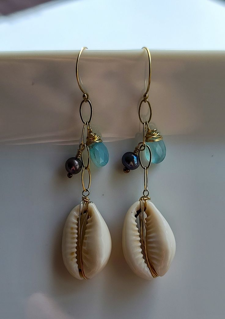 Leho Earrings - Cowrie Shell Endless summer days... Nothing says summer like shells, feel summer all year round with these cowry shell earrings. Whether your style is casual, business, sensual, or something totally just you, you can add a little piece of sunshine to your look with these sea shell earrings. If you're the type of person who likes to embrace the summer, unique beach jewelry is the way to go! Just make sure you remember to take them off if you go in the water! You can customize thes Sea Shell Earrings, Cowry Shell, Type Of Person, Unique Beach, Shell Jewelry, Cowrie Shell, Shell Earrings, Endless Summer, Beach Jewelry