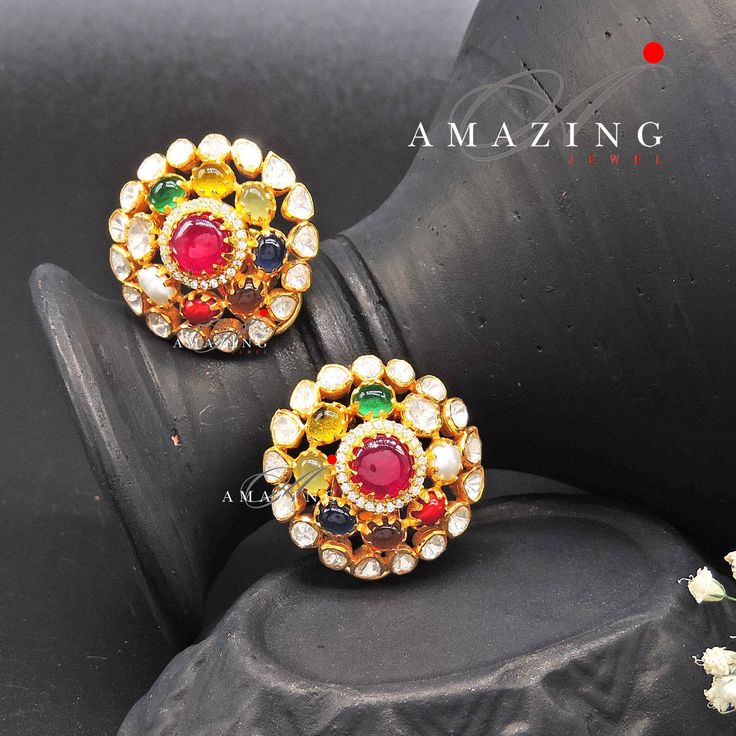 Navratna Stone Earring |Semi Precious Navaratna Earring | Moissanite Polki Earring | Indian Wedding Jewelry | Stud | Earring Material: Silver Gemstone: Moissanite, Semi Precious Navratna Stones  Stone colour:  Uncut Polki Primary colour: Gold Size-Length: 28mm Width: 28mm Closure: Screw back and Clips Silver Intricate, hand-crafted, Pure Silver Polki Earrings, studded with high-quality Semi Precious Navratna Stones, Earring comes with a screw back and clips, made in 92.5 silver with 22ct gold pl Navarathan Earrings, Fusion Kundan Bridal Earrings For Weddings, Fusion Style Kundan Bridal Earrings For Wedding, Fusion Style Kundan Bridal Earrings For Reception, Temple Jewelry Style Bridal Earrings With Stone Work, Temple Style Bridal Earrings With Stone Work, Festive Fusion Bridal Earrings With Hand Set, Kundan Fusion Bridal Earrings For Celebrations, Fusion Style Bridal Earrings With Cutdana For Diwali