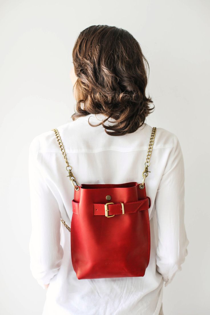 Leather Backpack Women, Bags for Women, Leather Shoulder Bag, Red Crossbody Bag with Chain, Evening Bag 💓Convertible bag, 3 in One ! Cross body/ Handbag/ Backpack Chain Edition🎀 * Simple, Elegant * High Quality, natural leather * Safe - Front buckle and button snap closing mechanism. * Interior pocket with zipper * Easily Convertible - Cross body, shoulder bag, backpack * No lining *Comes with Antique Brass Chain ⚠ Color of the bag may be a little different, it depends on a leather batch, whic Bucket Bag With Gold-tone Hardware For Gift, Gift Shoulder Bag With Gold-tone Hardware, Everyday Bucket Bag With Chain Strap Satchel, Everyday Backpack With Chain Strap, Red Travel Bucket Bag With Phone Pocket, Red Travel Bucket Bag With Mobile Phone Pocket, Red Crossbody Bucket Bag With Gold-tone Hardware, Red Travel Bucket Bag With Mobile Phone Holder, Red Rectangular Bucket Bag With Gold-tone Hardware