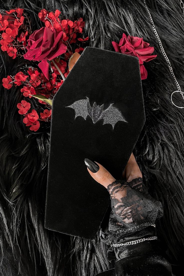 VELVET CASKET.- Statement velvet coffin shaped jewellery box.- Multiple cushioned ring slots.- Necklace tray.- Fully lined.- Embroidered bat decal.- Height 5cm/1.9".- Width 26cm/10.2".- Length 13cm/5.1".with KILLSTAR branding, 100% Polyester. 2010 Fashion, Goth Home, Goth Home Decor, Velvet Ring Box, Cushion Ring, Gothic Decor, Gothic Home Decor, Dog Hoodie, Grunge Fashion