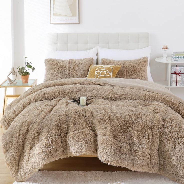 the bed is made with fluffy fur and pillows