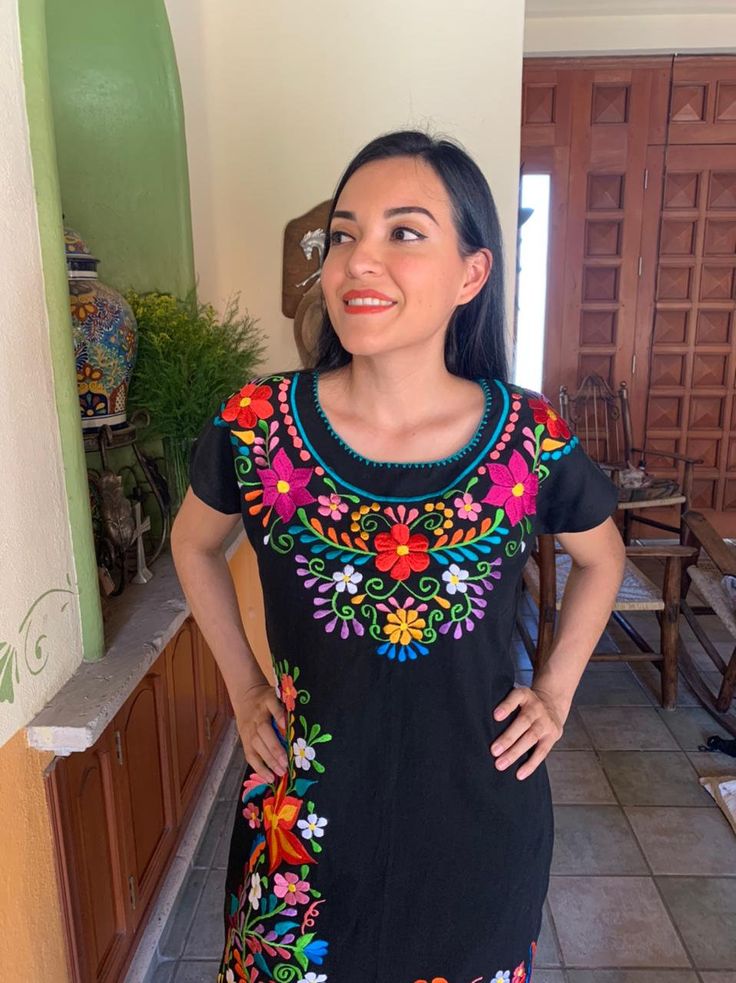 Beautiful dress embroidered with bright colors by artisans from the state of Oaxaca, to pour on any occasion. This dress has straps to adjust at the back. Each dress has a unique embroidery, so colors may vary. The short sleeveless and embroidered dresses hand, they are also beautiful, unique pieces. Mexican textile art has centuries of history and creativity throughout the country. Mexico is recognized as one of the leading countries with a beautiful artistic production in the textile world, mi Folk Style Dresses With Intricate Multicolor Embroidery, Cotton Dresses With Geometric Embroidery And Short Sleeves, Short Sleeve Cotton Dress With Geometric Embroidery, Black Dresses For Cinco De Mayo Fiesta, Traditional Multicolor Fiesta Dress, Cotton Embroidered Dress With Floral Embroidery For Fiesta, Traditional Spring Dress With Embroidered Neckline, Traditional Multicolor Dress For Fiesta, Cotton Dress With Embroidered Hem For Fiesta