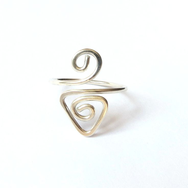 This triangle spiral ring is handcrafted with solid Sterling Silver. ❀ Easily adjustable, so perfect for gifts - just choose Small, Medium or Large. ❀ Or for a custom fit, tell us your ring size or measurement when you order. ❀ Made with 935 Sterling Silver, which has excellent shine and tarnish resistance. ❀ Your ring will be nicely gift wrapped and mailed in eco-friendly packaging. See more rings here... https://etsy.me/30DLNzN Adjustable Midi Rings With A Modern Twist For Gifts, Modern Twist Adjustable Midi Rings As Gift, Adjustable Spiral Promise Rings, Adjustable Spiral Rings With A Modern Twist, Adjustable Spiral Midi Rings In Minimalist Style, Adjustable Swirl Ring As Gift, Adjustable Spiral Ring With Modern Twist, Adjustable Spiral Ring With A Modern Twist, Handmade Spiral Minimalist Rings