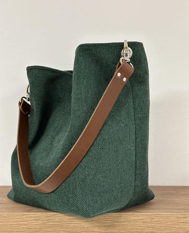 An elegant hobo bag in forest-green canvas with a leather handle for on-trend, ultra-practical shoulder carrying! This tote bag with its sportswear look and contemporary color will easily match your seasonal outfits!  Designed in a beautiful canvas, the bag features a firm leather handle available in 3 colors, with 2 large snap hooks that attach to the bag's eyelets: CONTACT ME IF YOU'RE MISSING A COLOR! The bag is lined on the inside with a pretty coordinating printed cotton fabric and 2 patch Canvas Hobo Bag, It Bag, Tablet Bag, Large Handbags, Zip Pouch, Wallet Bag, Shopper Bag, Glasses Case, Canvas Tote Bag