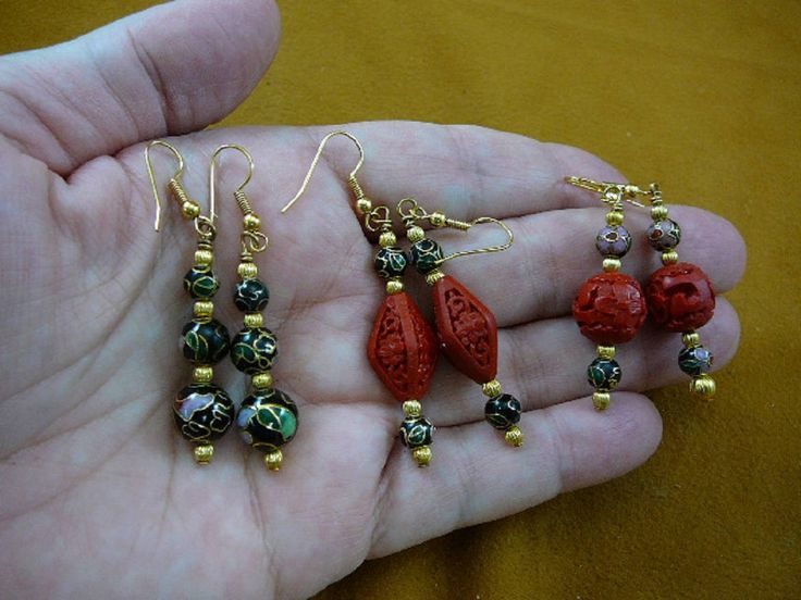 "(Internal #V-283) You are bidding on a beautiful, handmade, Cloisonné beaded necklace and earrings set. NECKLACE: Black cloisonne and Red cinnabar beads Huge 40 mm bottom bead (black cloisonne round), Four 35 mm round black cloisonne beads, Four 30 mm cinnabar round beads, Two \"Pumpkin\" shaped red cinnabar beads Black cloisonne round 10, 8 and 8 mm graduated; six diamond shaped 19x10 mm red cloisonne beads with brass spacer beads 8 and 5 mm Length: 32\" 3 pairs FRENCH WIRE EARRINGS: 1) Three Traditional Gold Earrings With Faceted Beads, Traditional Festive Earrings With Faceted Beads, Traditional Faceted Beads Earrings For Gift, Single Bead, Long Beaded Necklace, Set Necklace, French Wire, Necklace Black, Diamond Shaped