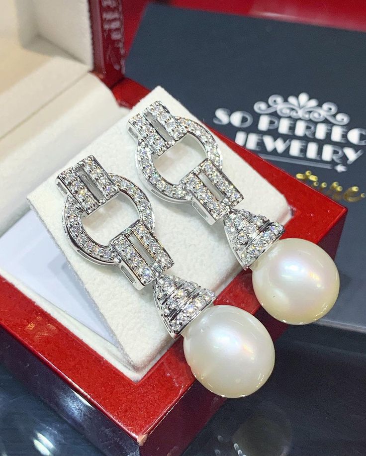 We are presenting you a HUGE pair of Art Deco, CHANDELIER, Genuine, LUSTROUS PURE WHITE, South Sea Pearls, extremely FINE AA+, LUSTROUS and Rare! Accenting the 2 pearls are 98 pieces of E/VS Natural diamonds, weighting a total of 1.58 carats. Set in GORGEOUSLY designed 18K solid white gold Art Deco earrings! PERFECT FOR SPECIAL OCCASIONS! SO BIG AND GORGEOUS! EVERYONE WILL FALL IN LOVE WITH THEM THE MINUTE THEY SEE YOU WEARING THEM! ONLY ONE ITEM AVAILABLE!! NO DUPLICATES!! WHAT YOU SEE IN THE P Elegant Pearl White Chandelier Earrings, Elegant Wedding Chandelier Earrings With Diamond Accents, Luxury Wedding Pearl Earrings With Diamond Accents, Luxury Pearl Earrings With Diamond Accents For Wedding, White Pearl Earrings With Diamond Accents For Wedding, Luxury Diamond White Chandelier Earrings With Elegant Design, Luxury Chandelier Earrings In Diamond White With Elegant Design, Exquisite Diamond White Pearl Earrings For Wedding, Elegant Diamond Chandelier Earrings For Wedding