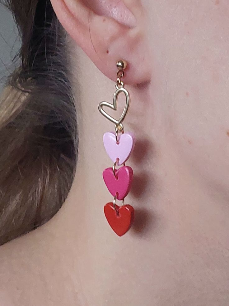 https://purplebeestudio.etsy.com Dainty earrings in bright red, raspberry and pink. Handcrafted from polymer clay with brass heart charm, ear posts and backs. The earrings are very light and comfortable to wear. Nice gift for your loved ones. All my earrings are handcrafted, sanded, buffed and polished with two layers of special semi-gloss varnish for better surface protection. Product care:  - To ensure the product quality and durablility, avoid contact with water, lotion, perfumes and household cleaners and chemicals. - You can clean the products with a slightly damp soft fabric.  - Sharp objects can damage the clay surface. - When not in use, store in a dry, seperate box. Thank you for visiting my shop! If you have any special requests, I'll be happy to do my best to accommodate. Cute Dangle Earrings For Valentine's Day, Fun Dangle Jewelry For Valentine's Day, Fun Handmade Jewelry For Valentine's Day, Playful Red Jewelry For Valentine's Day, Pink Heart Beads Earrings For Gifts, Fun Dangle Earrings For Valentine's Day, Playful Handmade Earrings For Valentine's Day, Handmade Fun Earrings For Valentine's Day, Playful Handmade Red Jewelry