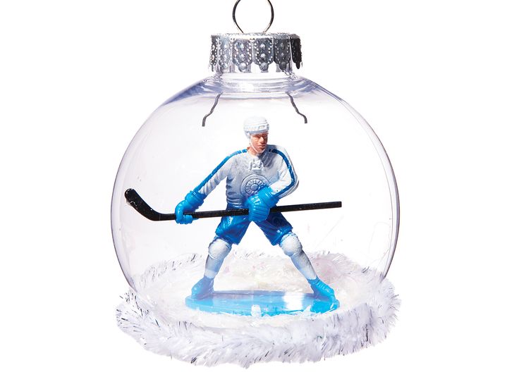 a glass ornament with a hockey player inside