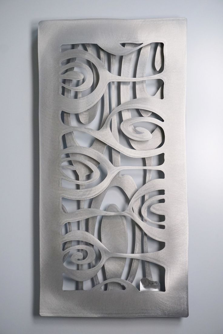 an abstract metal artwork on the wall