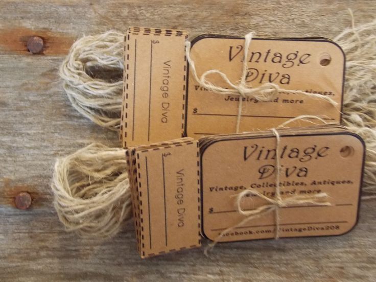 three brown tags with twine on them