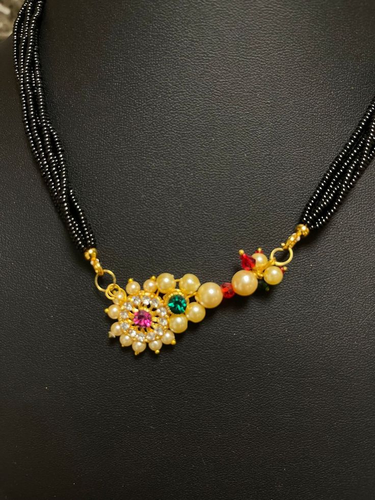 Experience the beauty of fusion with our remarkable Nath Mangalsutra. This unique piece combines the charm of a traditional nose ring (Nath) with the significance of a marriage necklace (Mangalsutra), creating a stunning adornment that celebrates love and heritage. The Nath pendant adds an intricate touch to the mangalsutra, symbolizing the beauty of both modernity and tradition. Crafted to perfection, this piece becomes a reflection of your unique style and your appreciation for cultural values. Whether you're a bride seeking a distinctive wedding ensemble or a woman who values the essence of unity in diversity, this Nath mangalsutra encapsulates the essence of both. Embrace the harmonious blend and embark on your journey adorned with this captivating symbol of love and tradition. Necklace Mangalsutra, Marriage Necklace, Traditional Nose Ring, Cultural Values, Unity In Diversity, Love Symbols, Jewelry Sets, Unique Pieces, Unique Style