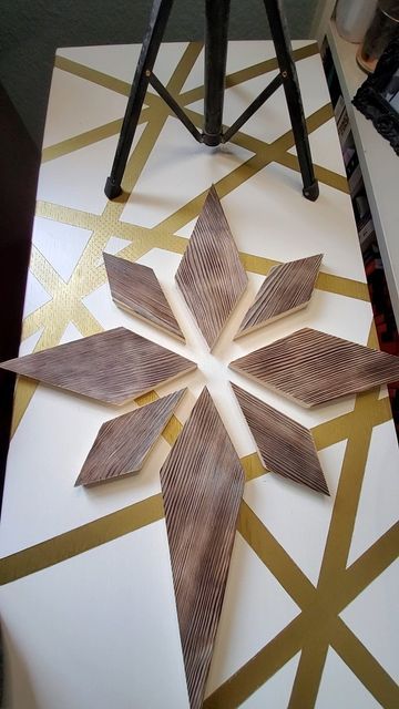 a wooden snowflake sitting on top of a table