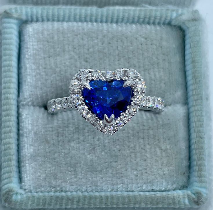 Beautiful Heart Shape Sapphire and Diamond Ring White Gold. The heart shape sapphire is a beautiful vibrant color and is full of life. You can tell this is a blue sapphire even from a distance, it's not too dark like most sapphires are. The diamonds are very sparkling. Excellent craftsmanship, all stones are set nice and smooth. The heart measures 10x11.2mm. Stunning heart ring for your sweetheart. This is one she will treasure for a lifetime; it's so sparkly! The diamonds are very clean, no bla Sapphire Heart Wedding Ring, Blue Sapphire Heart Ring, Heart Shaped Sapphire Ring, Gia Certified Heart Diamond Rings, Fine Jewelry Sapphire Heart Cut Ring, Heart Cut Sapphire Ring In Fine Jewelry Style, Heart Cut Sapphire Ring Fine Jewelry, Luxury Blue Jewelry For Valentine's Day, Blue Heart Cut Sapphire Ring For Formal Events