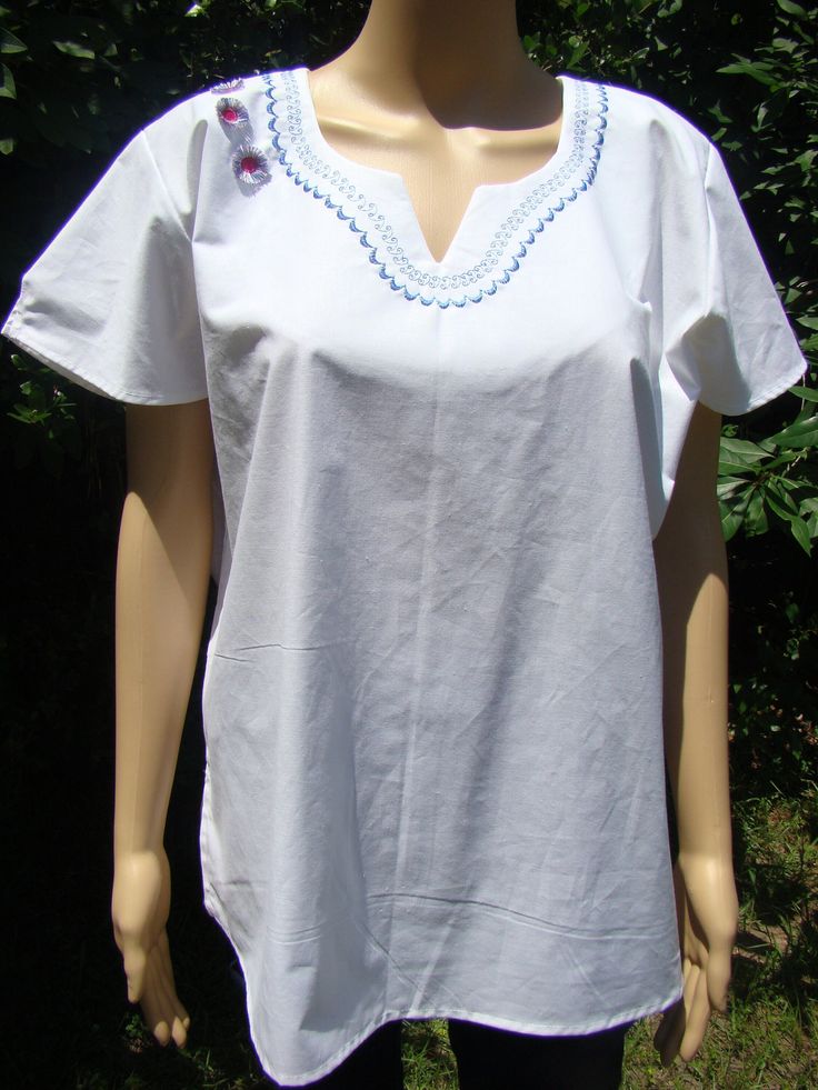 Hand Made Tunic, 100% cotton fabric with embroidered designs.  this hand made tunic can be hand or machine wash. This garment need to be iron after every wash to maintain its shape and beauty.  Comfortable and durable, this Tunic was created out of 100% cotton fabric.  The fabric will softened after every wash. White Embroidered Cotton Tunic Top, White Cotton Embroidered Tunic Top, White Cotton Tunic With Floral Embroidery, Peasant-style Embroidered Cotton Top For Beach, Cotton Peasant Blouse With Embroidered Neckline, Folk Style Cotton Blouse With Machine Embroidery, Cotton Folk Blouse With Machine Embroidery, Embroidered Hem Cotton Tunic Blouse, Cotton Tunic Blouse With Embroidered Hem