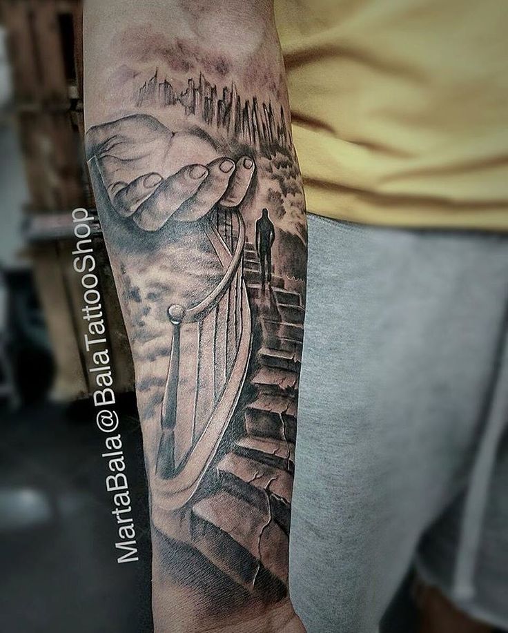 a man's arm with a black and grey tattoo on it that has stairs leading up to the sky