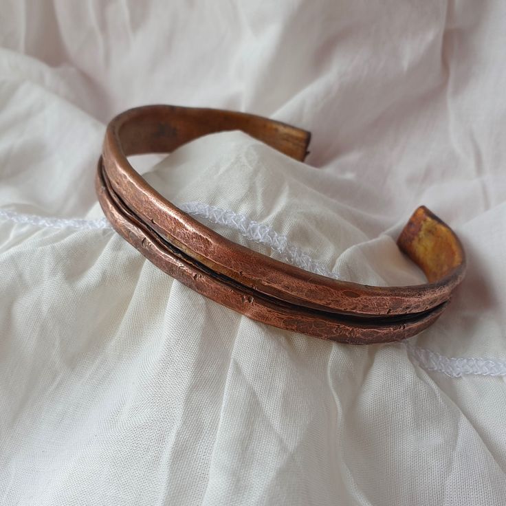 Handmade hammered stylish copper bracelet can be an excellent gift for Mеn or Women! This bracelet made of quality pure copper. Copper has been used since ancient times for it's natural and simple beauty. It's gorgeous with all skin tones and matches all your gold & bronzy jewelry. The bracelet can be made to order, personalized and adjustable for any size (just write me a message). You can added your inscription inside. Sizes is available in option "Bracelet length"   HOW TO CHOOSE THE RIGHT SI Rustic Cuff Bracelets As Gift, Hammered Rose Gold Cuff Bracelet Gift, Bronze Hand Forged Cuff Bracelet As Gift, Hand Forged Bronze Cuff Bracelet Gift, Bronze Cuff Bracelet Gift, Bronze Hammered Bracelet As Gift, Hand Forged Bronze Cuff Bracelet For Gift, Bronze Hand Forged Cuff Bracelet Gift, Bronze Copper Cuff Bracelet As Gift