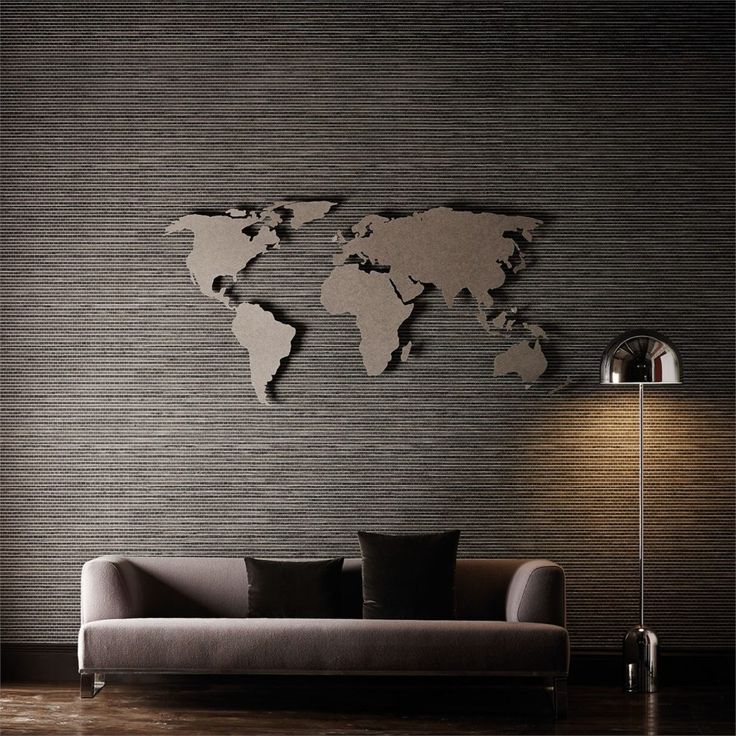 a living room with a couch and a large world map on the wall