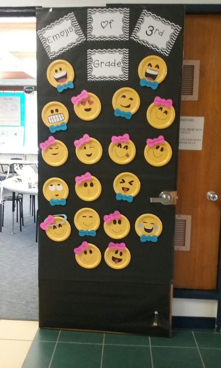 a door decorated with yellow and pink smiley face buttons on black paper, which reads instagram